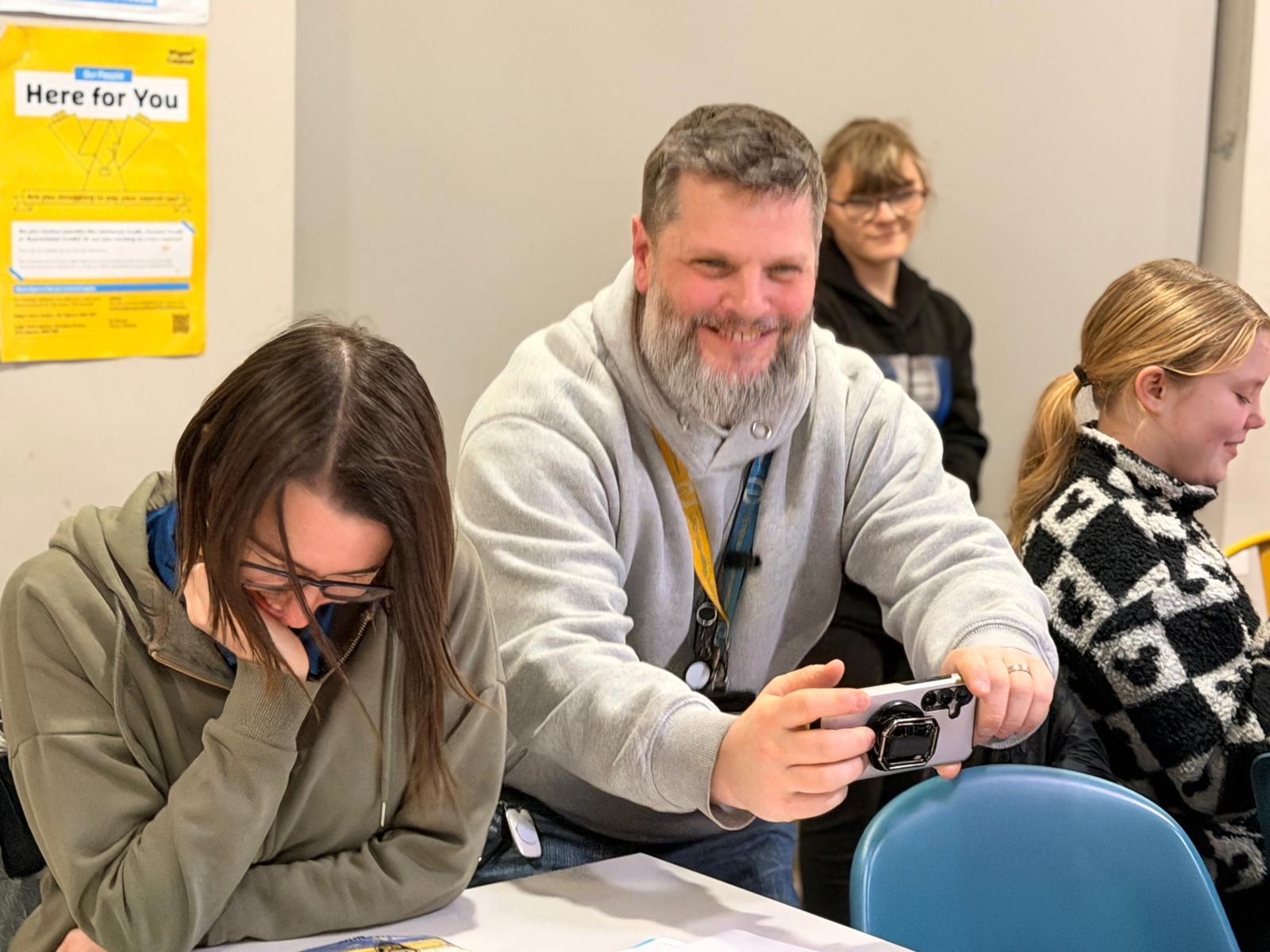 two pas taking photos at an event
